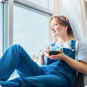 Person sitting near a bright window